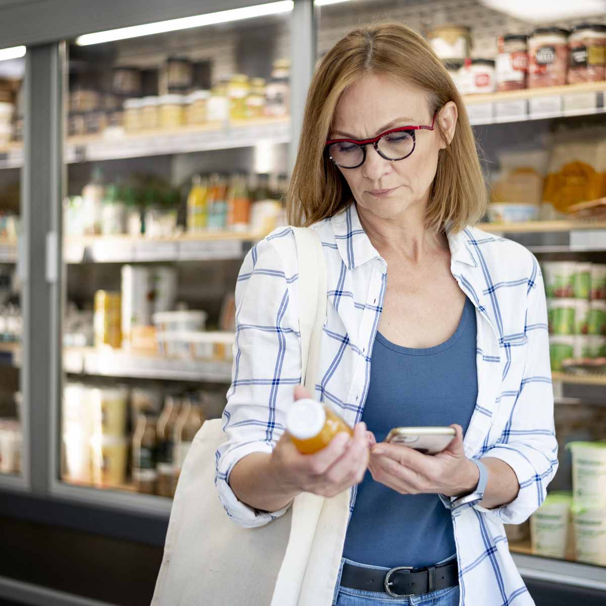 medium-shot-woman-checking-product